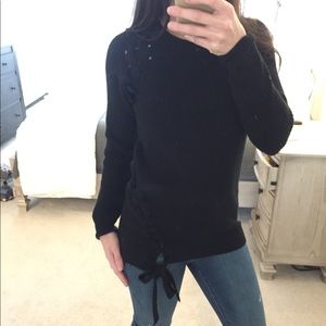 Black sweater with asymmetrical lacing on side